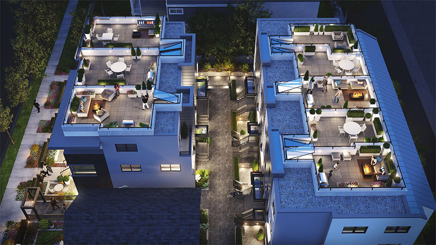 night shot of overhead residence showing roof top decks